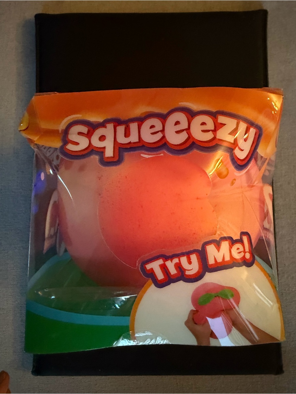 Squeezy Peach Stress Ball Toy box is  ent but BRAND NEW
